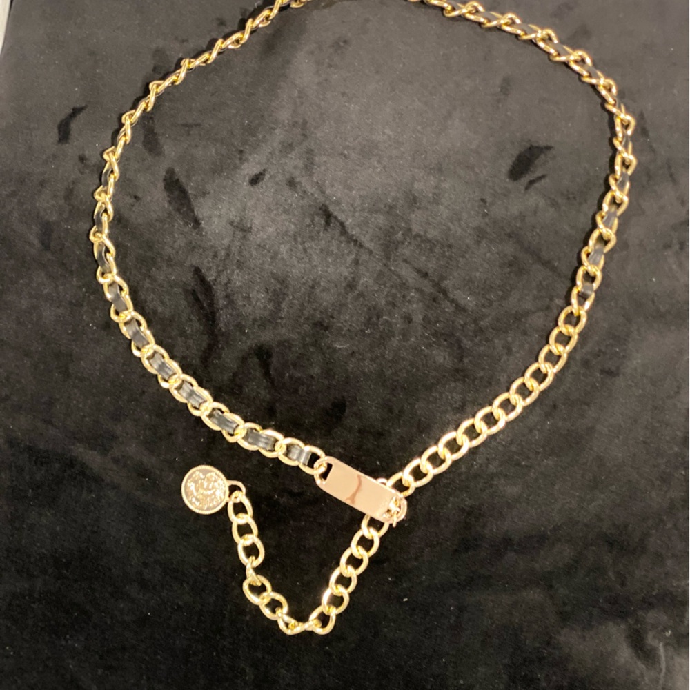 Vintage gold tone and black artificial leather women's belt.